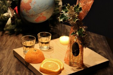 still life with homemade brandy, fruit and a globe in the background. Exotic climate