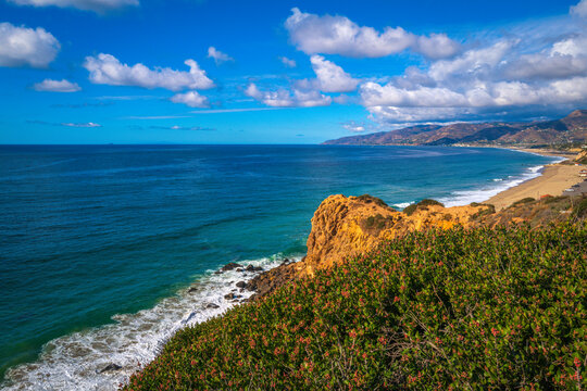 Panoramic Point Dume promontory seascape of Zuma Beach, Malibu, California, with views of the Pacific Ocean, blue horizon