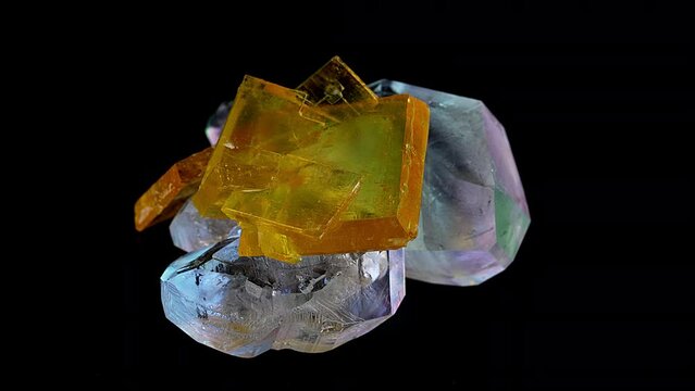 A precious rough stone for jewelry production rotates on an exhibition display