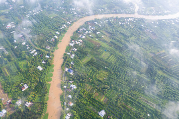 aerial view of white clouds and below is the Mekong river delta, South Vietnam. 