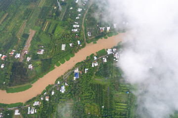 aerial view of white clouds and below is the Mekong river delta, South Vietnam. 