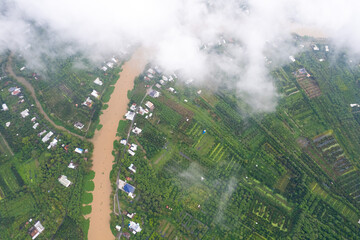 aerial view of white clouds and below is the Mekong river delta, South Vietnam. 
