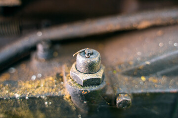 Oil pressure sensor on the body of the walk-behind tractor close-up