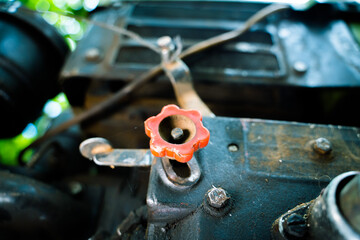 The gas pedal on the motoblock engine. Walk-behind tractor speed regulator
