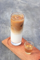 a glass of ice caffe latte in the morning