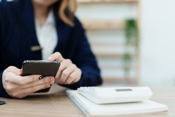 financial, Planning, Marketing and Accounting, portrait of Asian employee checking financial statements using and calculator, tablet computer and smart phone at work