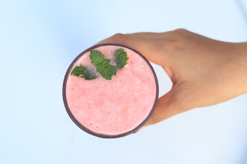 a glass of strawberry juice from top view