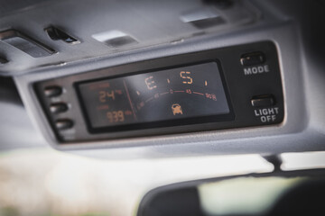 Old navigation system with compass in SUV car.