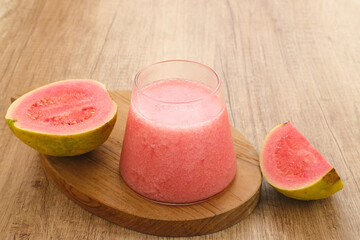 A glass of nutritious organic pink guava juice.
