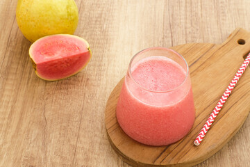 A glass of nutritious organic pink guava juice.
