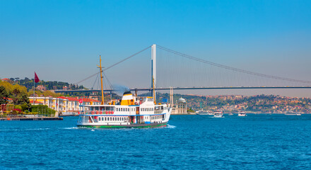 Fototapeta premium Sea voyage with old ferry (steamboat) in the Bosporus with Bosporus bridge, istanbul 