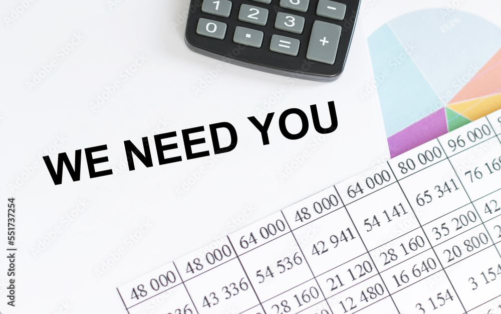Poster we need you text on a notebook on a table with documents, a business concept