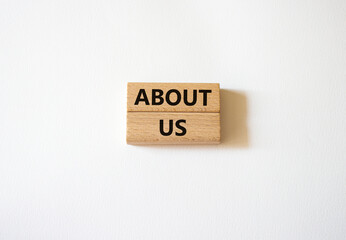 About us symbol. Wooden blocks with words About us. Beautiful white background. Business and About...