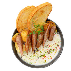 Portion of pan breakfast with sausages and cream sauce