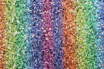 glitter pastel lights background. red, gold, purple, green and blue. de-focused