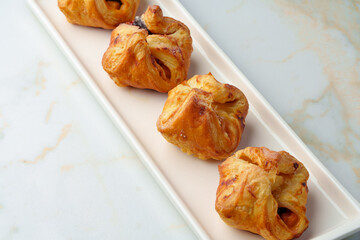 Banquet table with variety of stuffed pies pastry