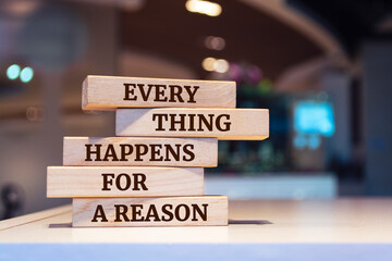 Wooden blocks with words 'Every Thing Happens For a Reason'.