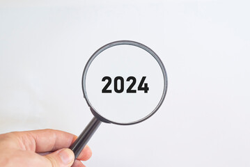 2024 was written with a magnifying glass. sustainable future idea.new business goal strategy concept.2024 goal planning business concept