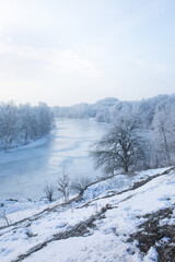 river at the foot of the mountain on a sunny winter morning