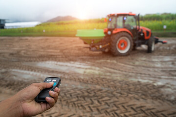 Hand to press remote control for  pushcart or tractor truck is rotary tillers for excavator in the...