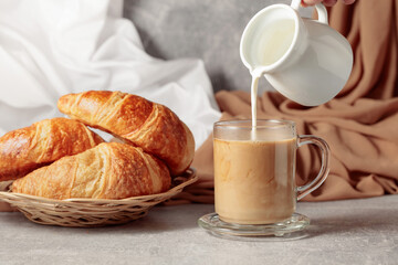Croissants and coffee with cream.