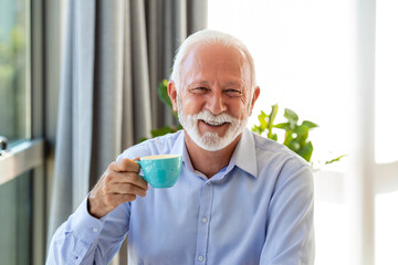 Shot of a senior financial businessman sitting in his office and drinking a cup of coffee while taking a break.