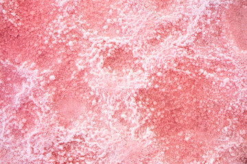 Pink lake - texture of pink salt as a background, unusual nature. A unique rare natural phenomenon. Salt lake with pink algae. Beautiful landscape.