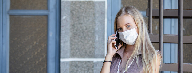 woman talking phone mobile wear mask during disease pandemic and to prevent dust that may enter the body through the nose and mouth.