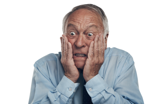 PNG shot of a senior businessman standing against a grey studio background with his face in his hands and looking shocked