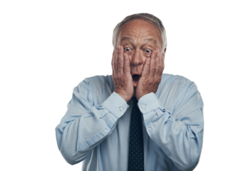 PNG shot of a senior businessman standing against a grey studio background with his face in his hands and looking shocked