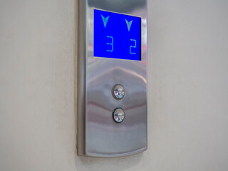 Panel with buttons to call the elevator.