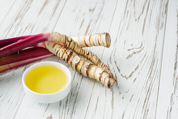 fresh yarrow root on a white acrylic background