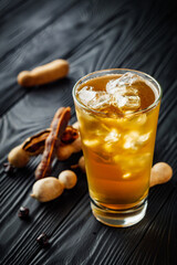 tamarind juice cooling drink on black rustic wooden background tea