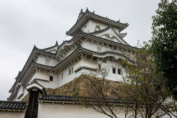 Fototapeta na wymiar Himeji, Japan. The main keep (tenshu) of the White Egret or Heron Castle, a castle complex from the Azuchi Momoyama period and a World Heritage Site