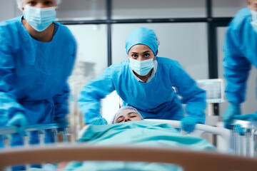 Surgeon, bed and rush in a hospital for emergency operation in the er with a sick patient. Surgery team, pushing sleeping woman and fast hospital bed in the theater for surgical medicine procedure - obrazy, fototapety, plakaty