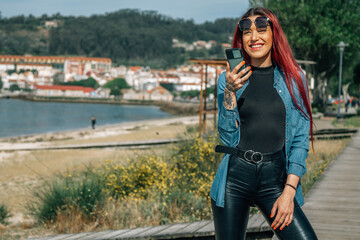 Fototapeta na wymiar woman with mobile phone in the seaport