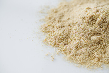 asafoetida aromatic powder on a white acrylic background