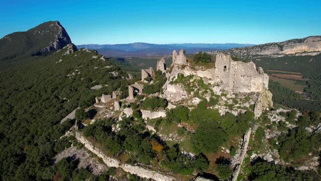 Aerial view of the Pic Siant  the Ch&acirc;teau de Montferrand on the ridge of the Pic Saint Loup in Herrault, Occitanie, France