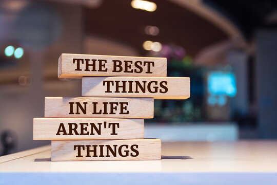 Wooden blocks with words 'The Best Things in Life Aren't Things'.