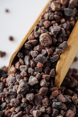 crystalline black Himalayan salt on a white background