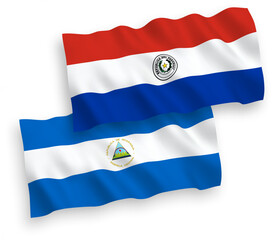 Flags of Nicaragua and Paraguay on a white background