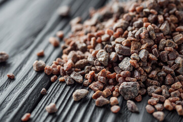 crystalline black Himalayan salt on a black wooden background