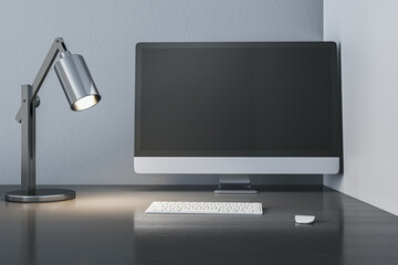 Creative designer wooden desk top with empty mock up computer monitor, lamp and keyboard. 3D Rendering.
