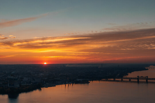 A beautiful sunset or dawn sky from a height above the city. Dnipro.Ukraine. Background picture. Dramatic evening cloud landscape in the city. Drone photography. Ukrainian city