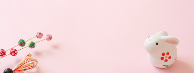 Fototapeta na wymiar Japanese New Year's card material. zodiac rabbit. Rabbit on pink background. 日本の正月素材。干支のウサギ。ピンク背景上のウサギ