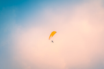 Motor Paraglider flying over sky of Ho Chi Minh City, Vietnam during New Year Festival and National...