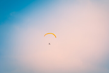 Motor Paraglider flying over sky of Ho Chi Minh City, Vietnam during New Year Festival and National Day