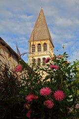 Close-up on the East side of Saint Philibert Abbey Church in Tournus, Burgundy, France, with its Roman external facade and tower