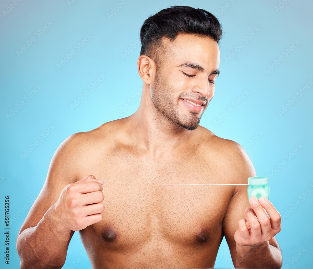 Sticker Man, body or dental floss for grooming, mouth hygiene maintenance or plaque removal help on blue background in studio. Smile, happy or flossing model and teeth product in healthcare wellness cleaning