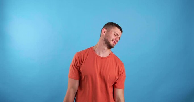 Young man full of hope becoming sad, because his hopes were not realized. Light blue background